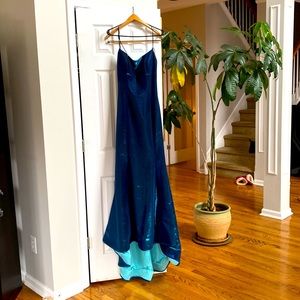Prom Dress.  Worn once.  Beautiful gown with a short train.  Backless. Standout